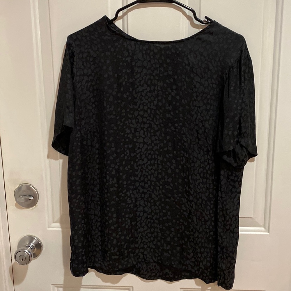 Target - a new day cheetah blouse. 100% polyester. Black and off black color.